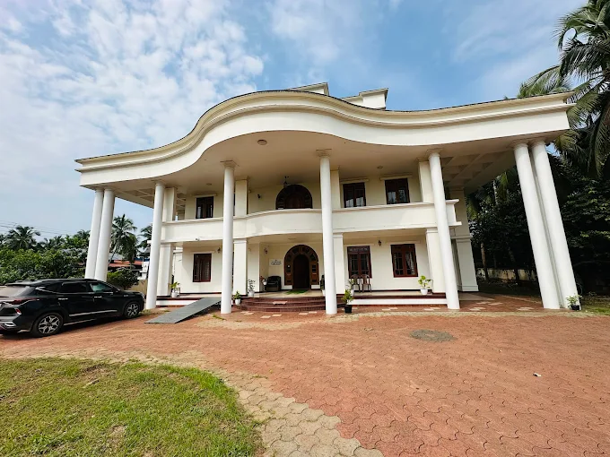 TSI Senior Care Home building exterior with palm trees and covered driveway